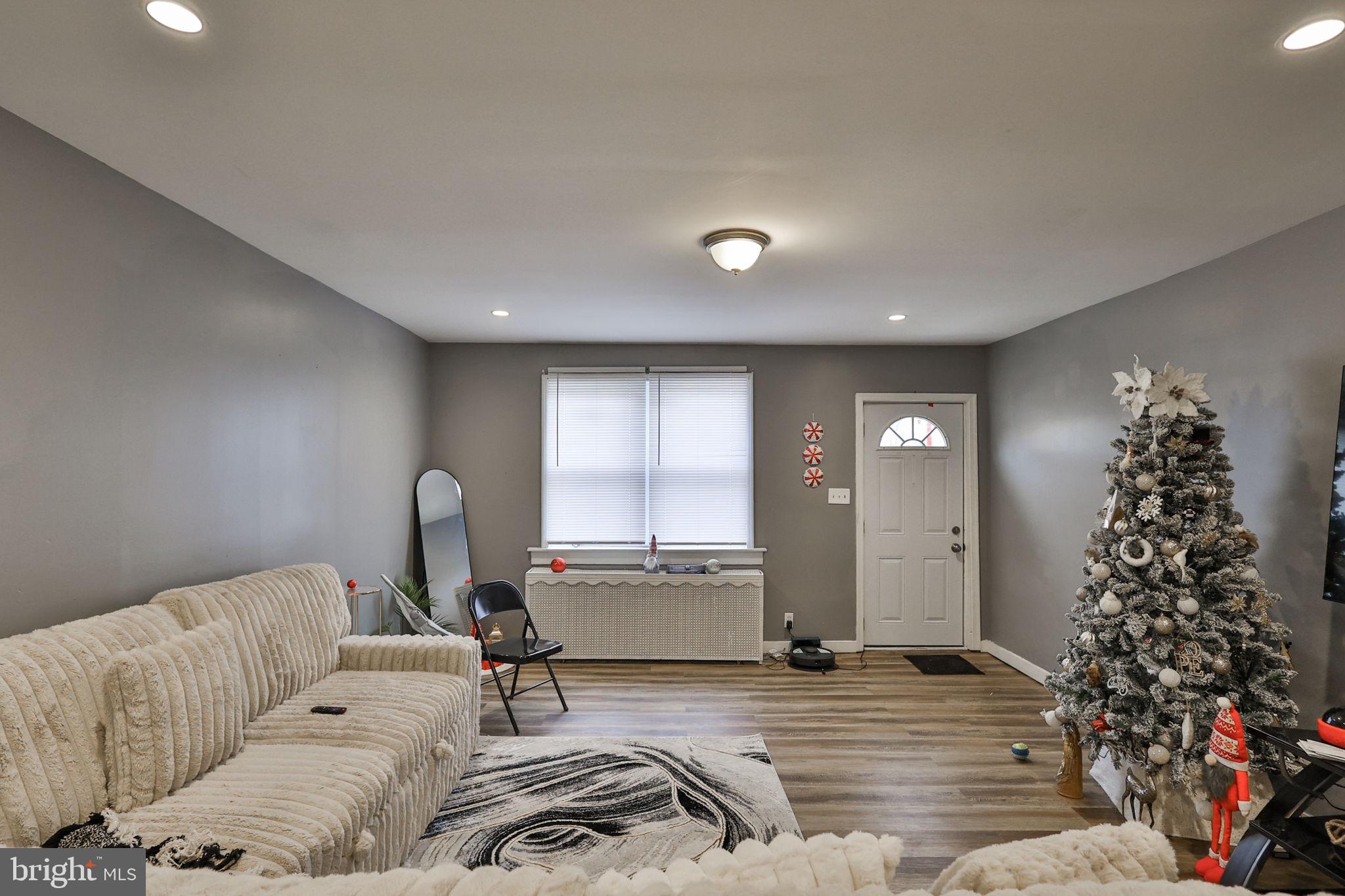 708 Ward Street Chester, PA 19013 - Photo 9 of 44 a living room with furniture and a potted plant