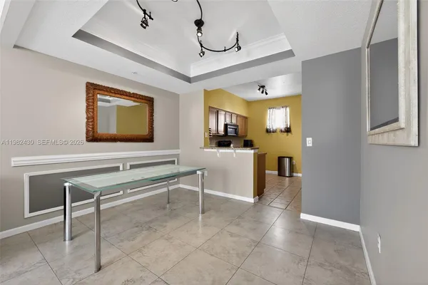 a view of a livingroom with furniture and a flat screen tv