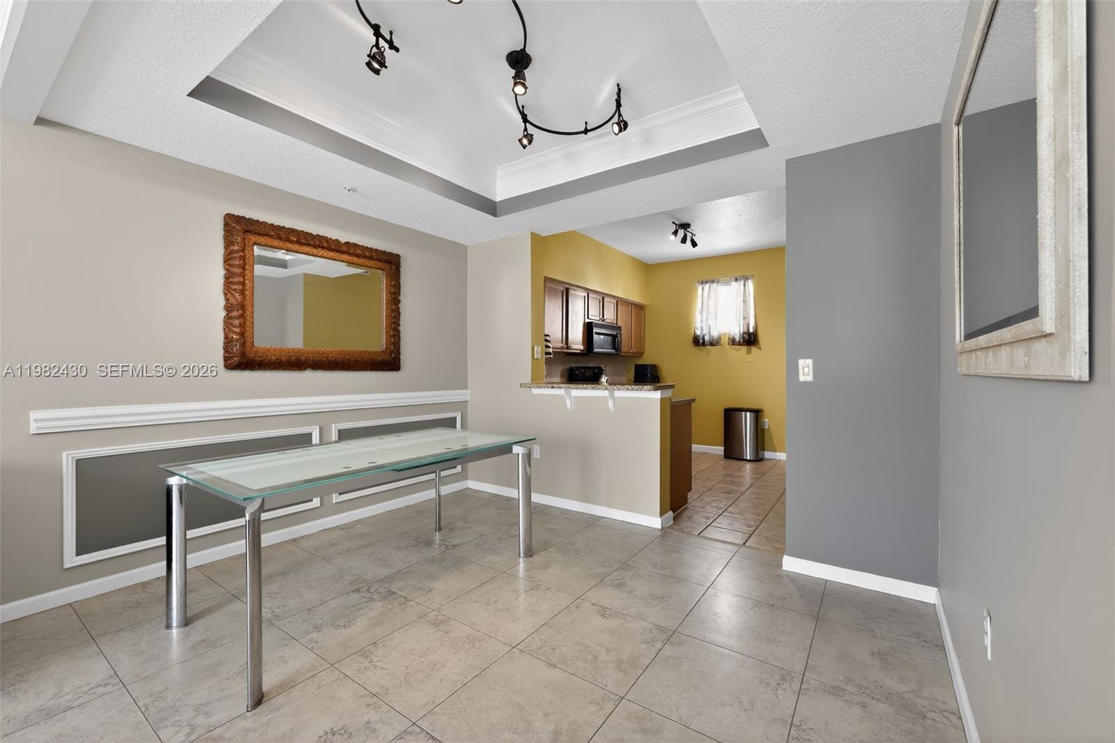 156 Aragon Way, Unit 103 Jupiter, FL 33458 - Photo 15 of 30 a view of a livingroom with furniture and a flat screen tv