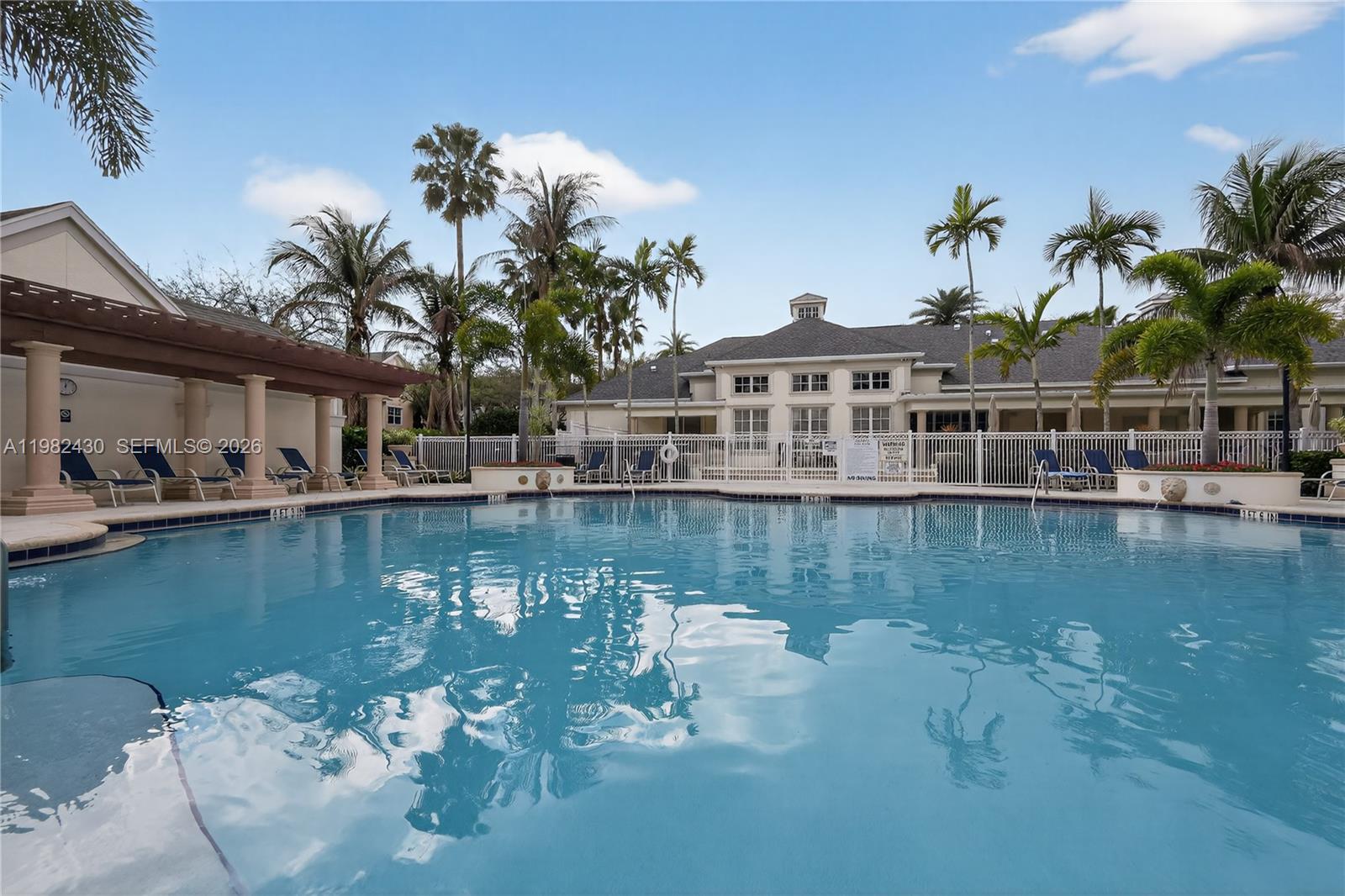 156 Aragon Way, Unit 103 Jupiter, FL 33458 - Photo 27 of 30 a view of a lake with a house