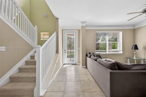 a living room with furniture and windows