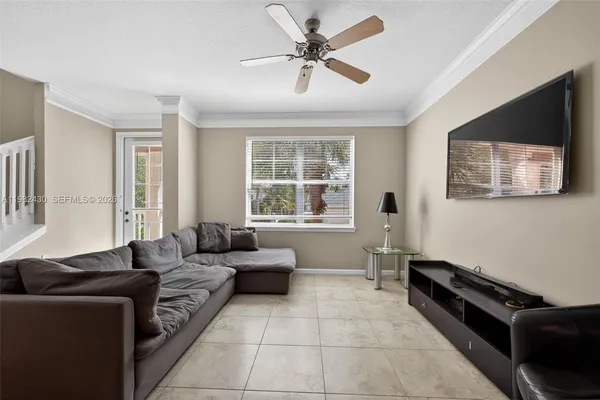 a living room with furniture and a flat screen tv