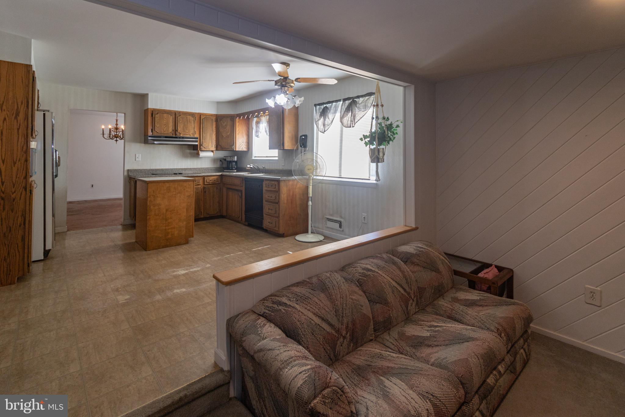 25 Champlain Road Marlton, NJ 08053 - Photo 11 of 35 a living room with a couch and a view of kitchen