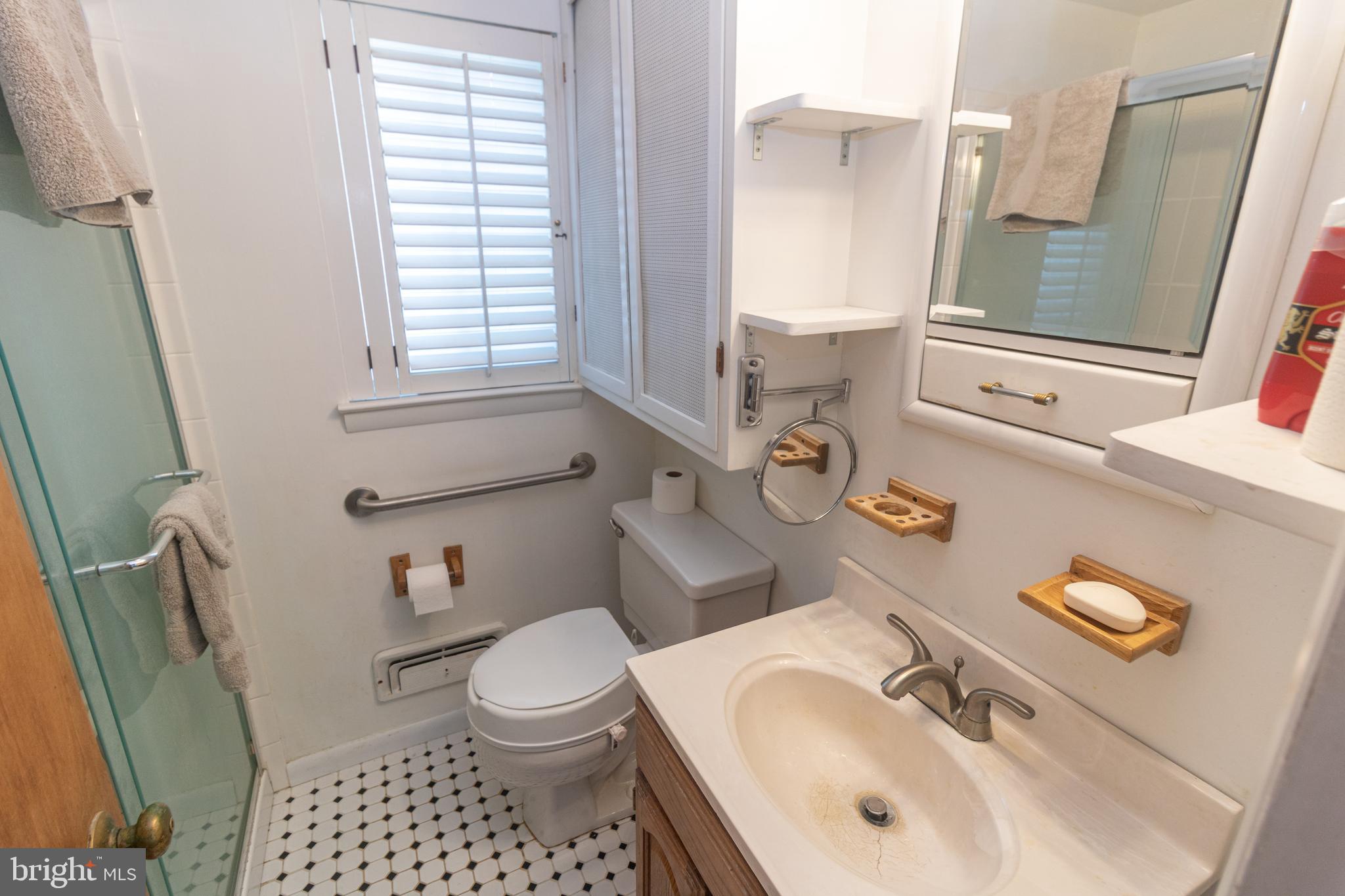 25 Champlain Road Marlton, NJ 08053 - Photo 20 of 35 a bathroom with a sink a toilet and a mirror