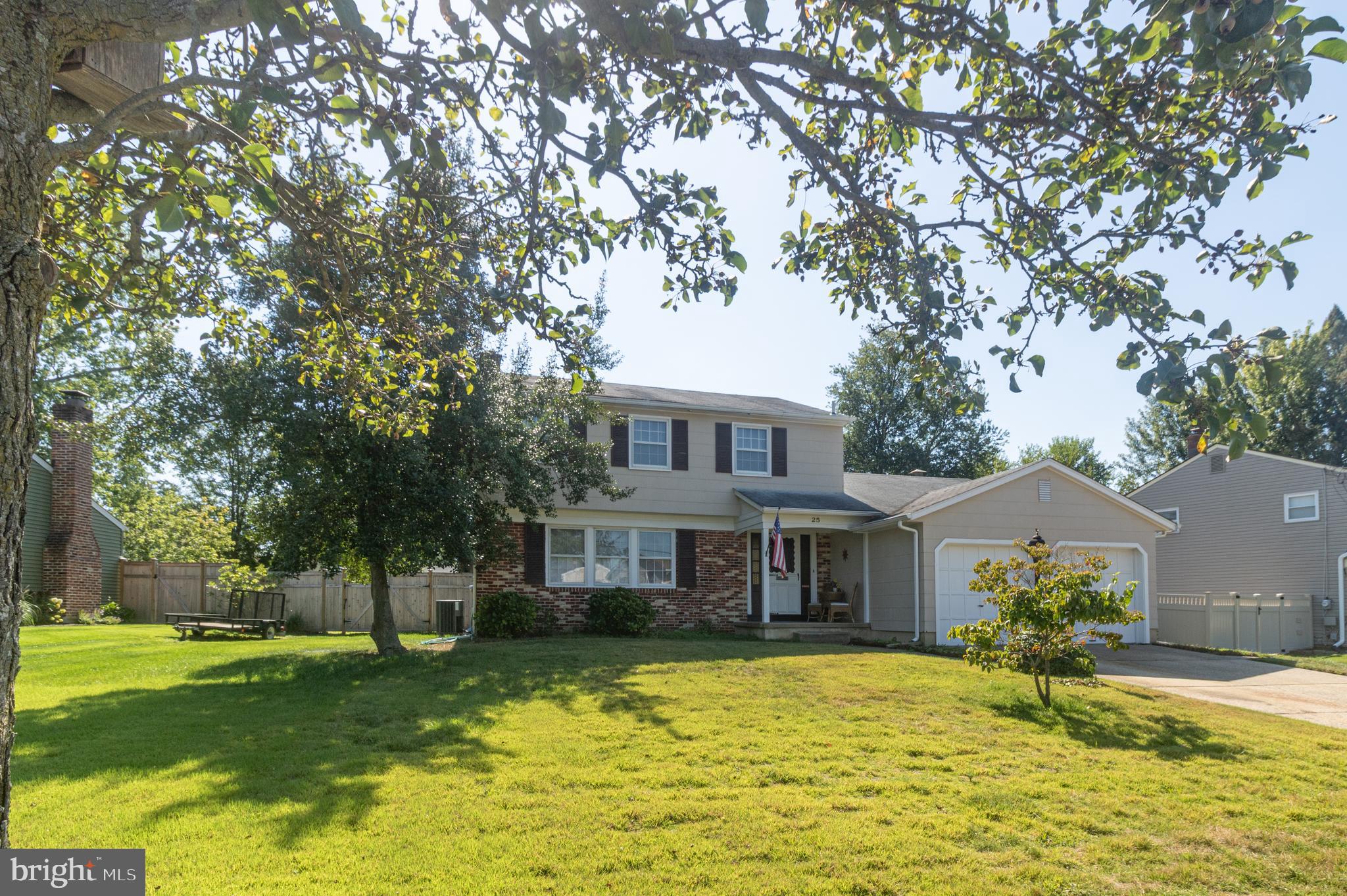 25 Champlain Road Marlton, NJ 08053 - Photo 2 of 35 a front view of a house with a yard
