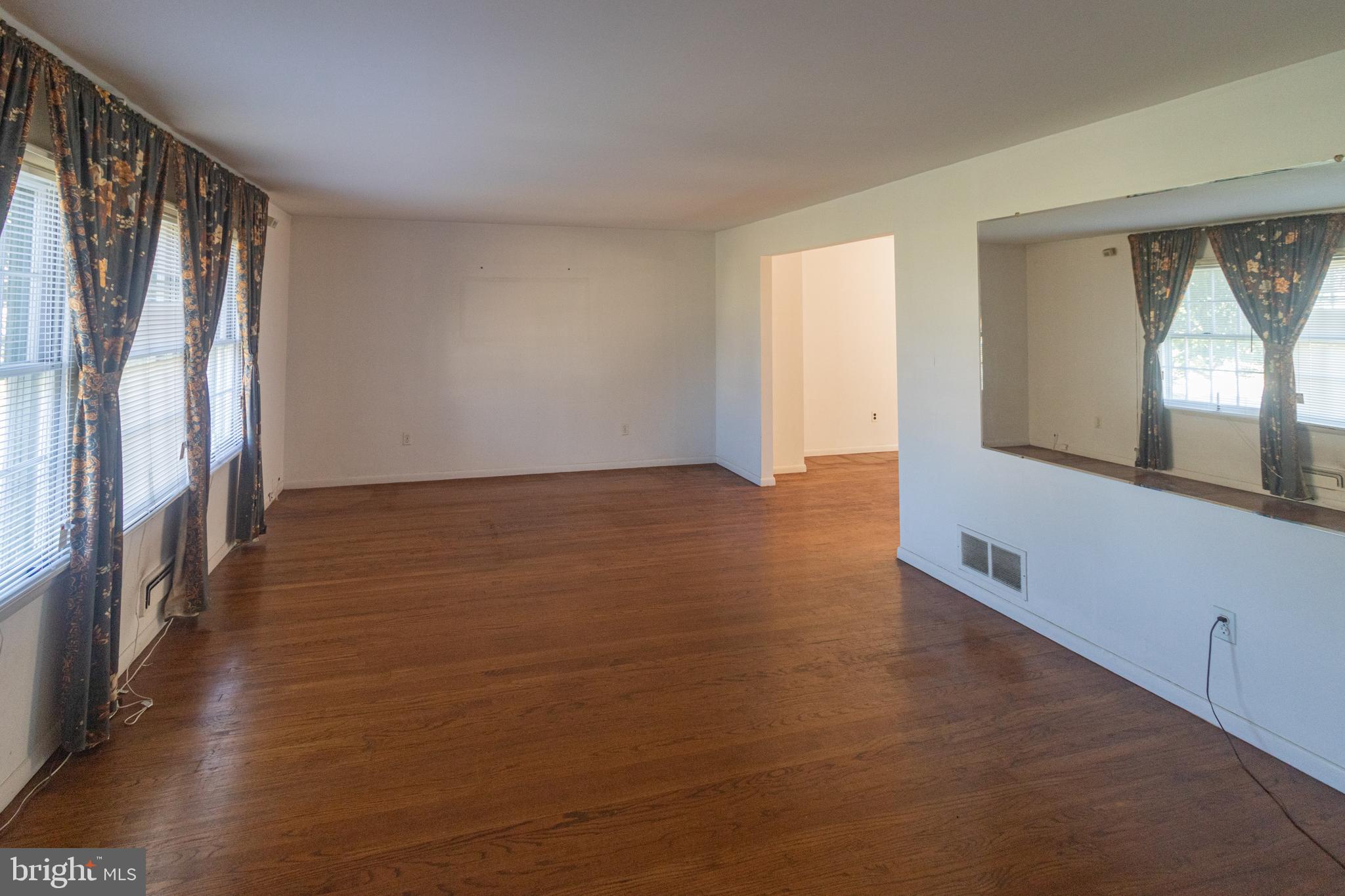 25 Champlain Road Marlton, NJ 08053 - Photo 3 of 35 a view of an empty room with wooden floor and a window