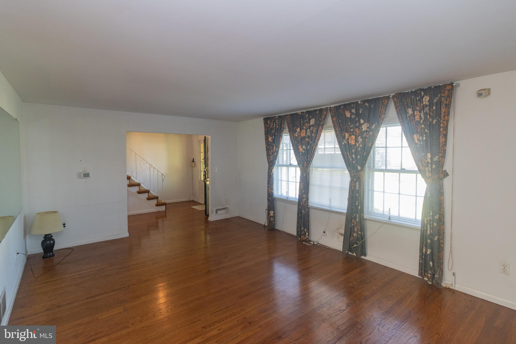 25 Champlain Road Marlton, NJ 08053 - Photo 4 of 35 an empty room with wooden floor and windows