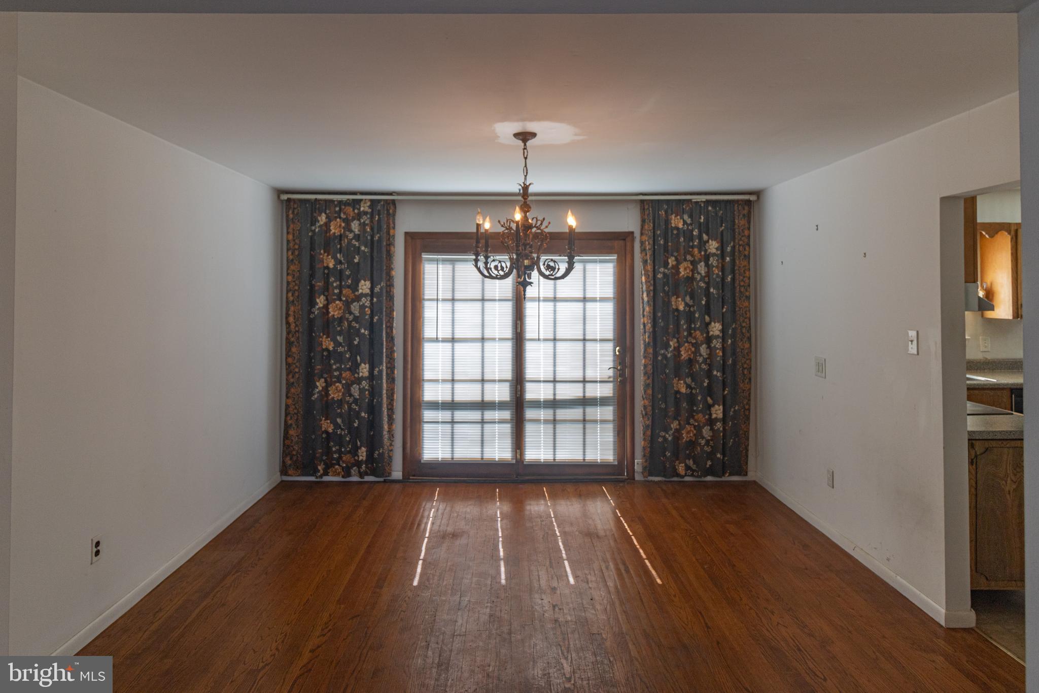25 Champlain Road Marlton, NJ 08053 - Photo 6 of 35 an empty room with wooden floor and windows