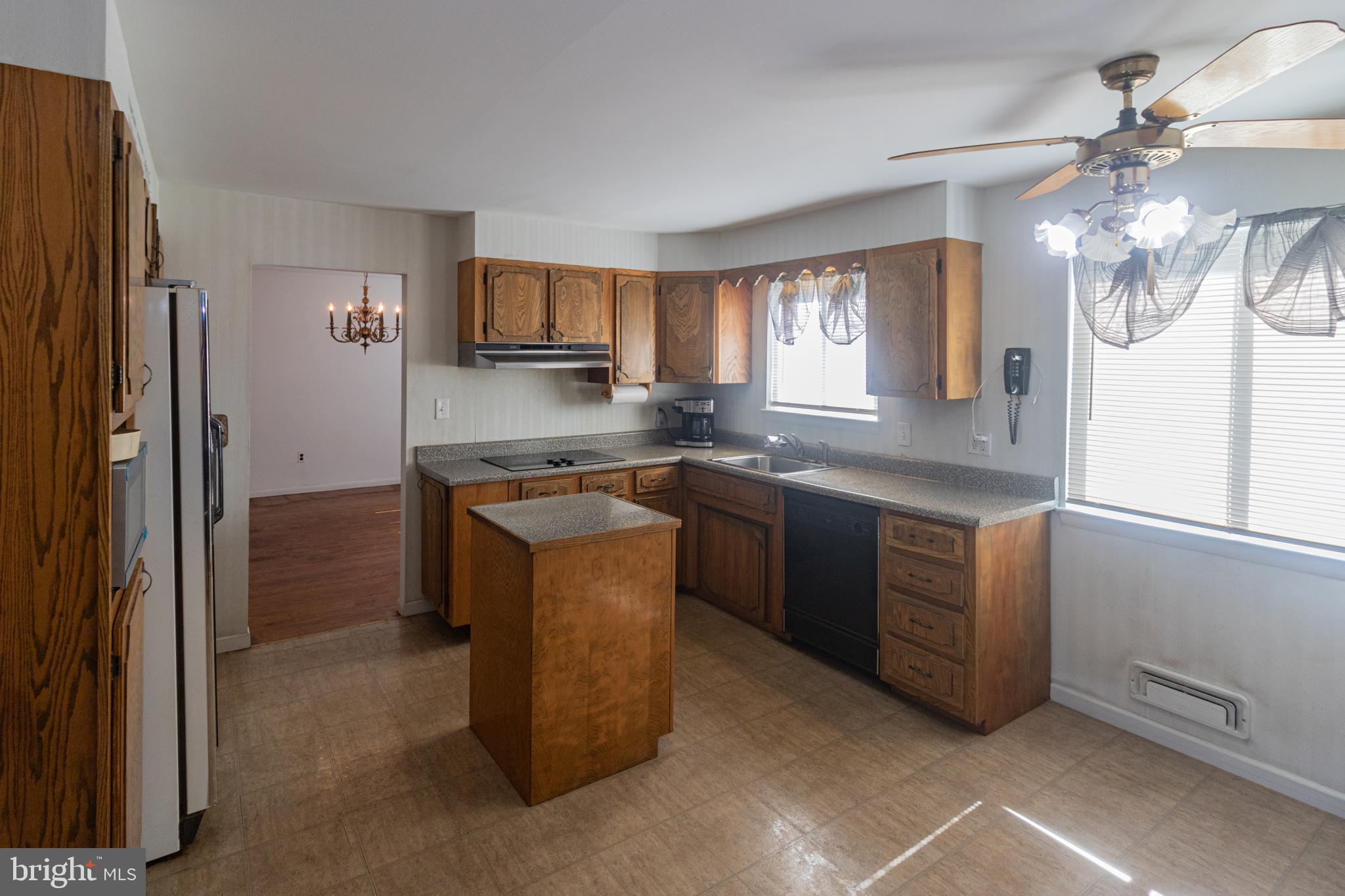 25 Champlain Road Marlton, NJ 08053 - Photo 10 of 35 a kitchen with stainless steel appliances granite countertop a sink a stove a refrigerator cabinets and a window