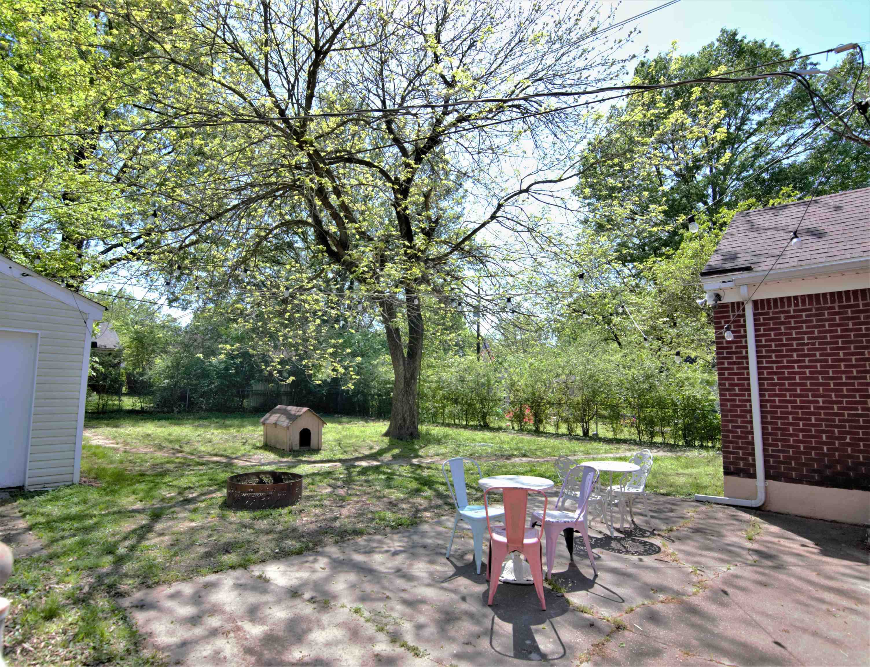 4349 Macon Road Memphis, TN 38122 - Photo 19 of 19 a view of a chair and table in backyard of the house