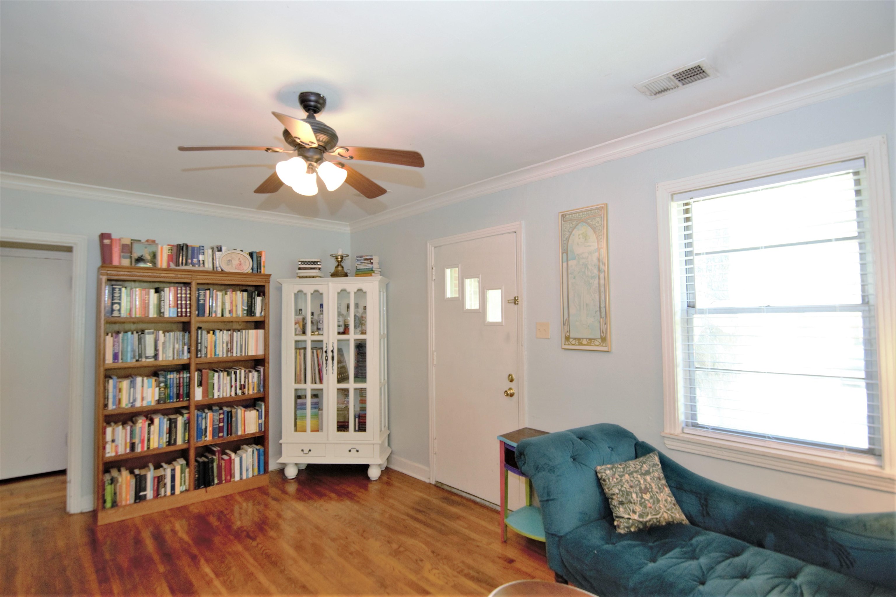 4349 Macon Road Memphis, TN 38122 - Photo 3 of 19 a living room with furniture and a book shelf
