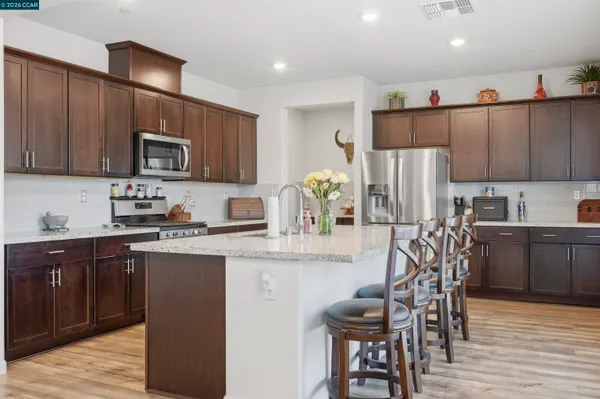 a room with lots of books and a dining table