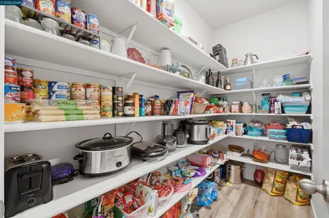 a view of a livingroom with a furniture and a potted plant