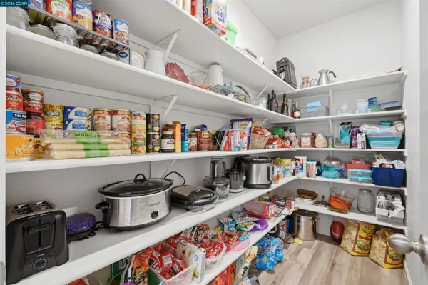 a view of a livingroom with a furniture and a potted plant