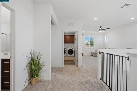 a work room with furniture and a window