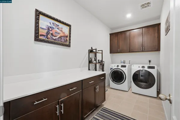 a living room with lots of furniture and a book shelf