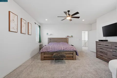 a view of living room with furniture and flat screen tv
