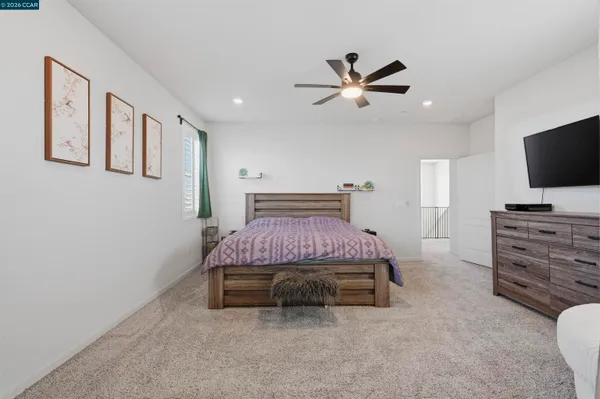 a view of living room with furniture and flat screen tv