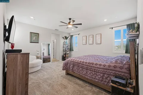 a spacious bathroom with a double vanity sink a mirror and a shower