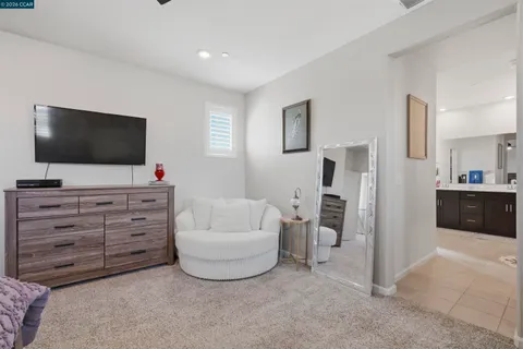 an aerial view of a house with swimming pool outdoor seating