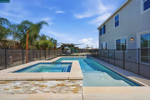 a view of a balcony with two chairs and a table
