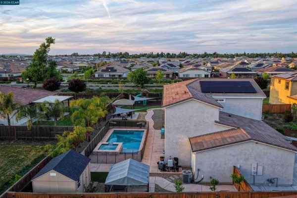 a view of a backyard with sitting area