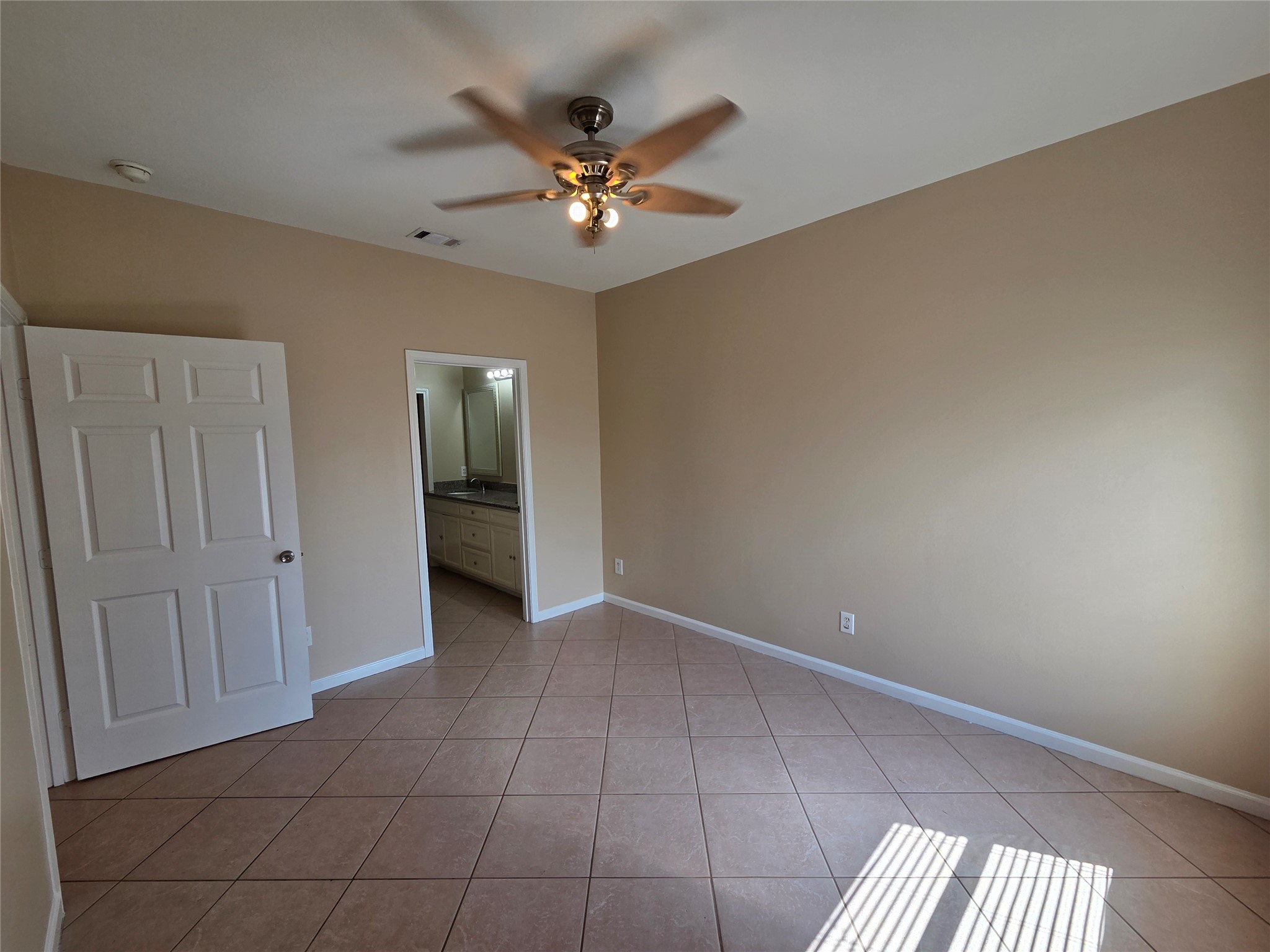 928 Runneburg Road Crosby, TX 77532 - Photo 11 of 27 a view of an empty room with a chandelier fan