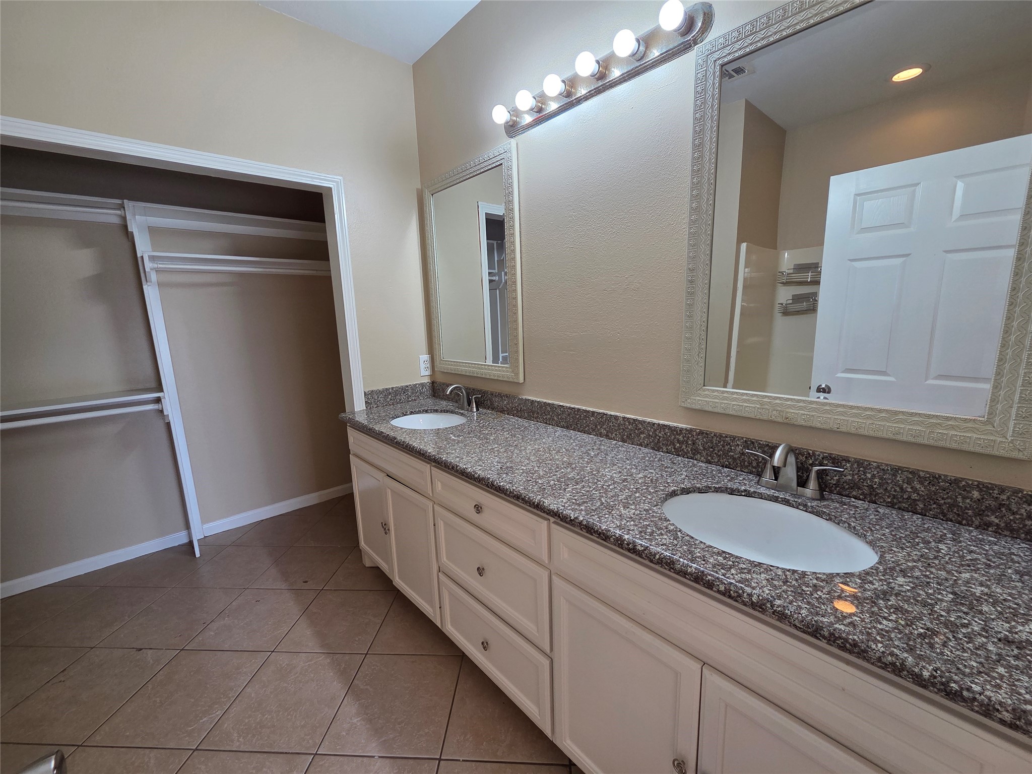 928 Runneburg Road Crosby, TX 77532 - Photo 21 of 26 a bathroom with a granite countertop sink and a mirror