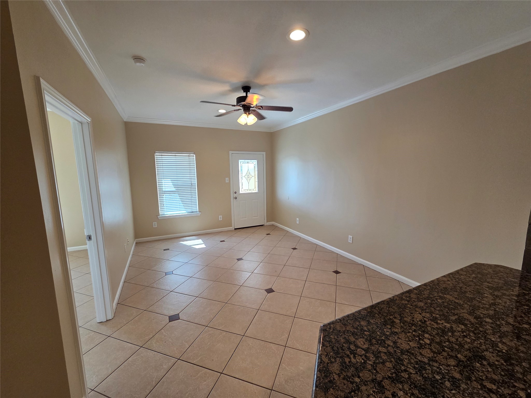 928 Runneburg Road Crosby, TX 77532 - Photo 7 of 27 a view of a livingroom with a ceiling fan and window