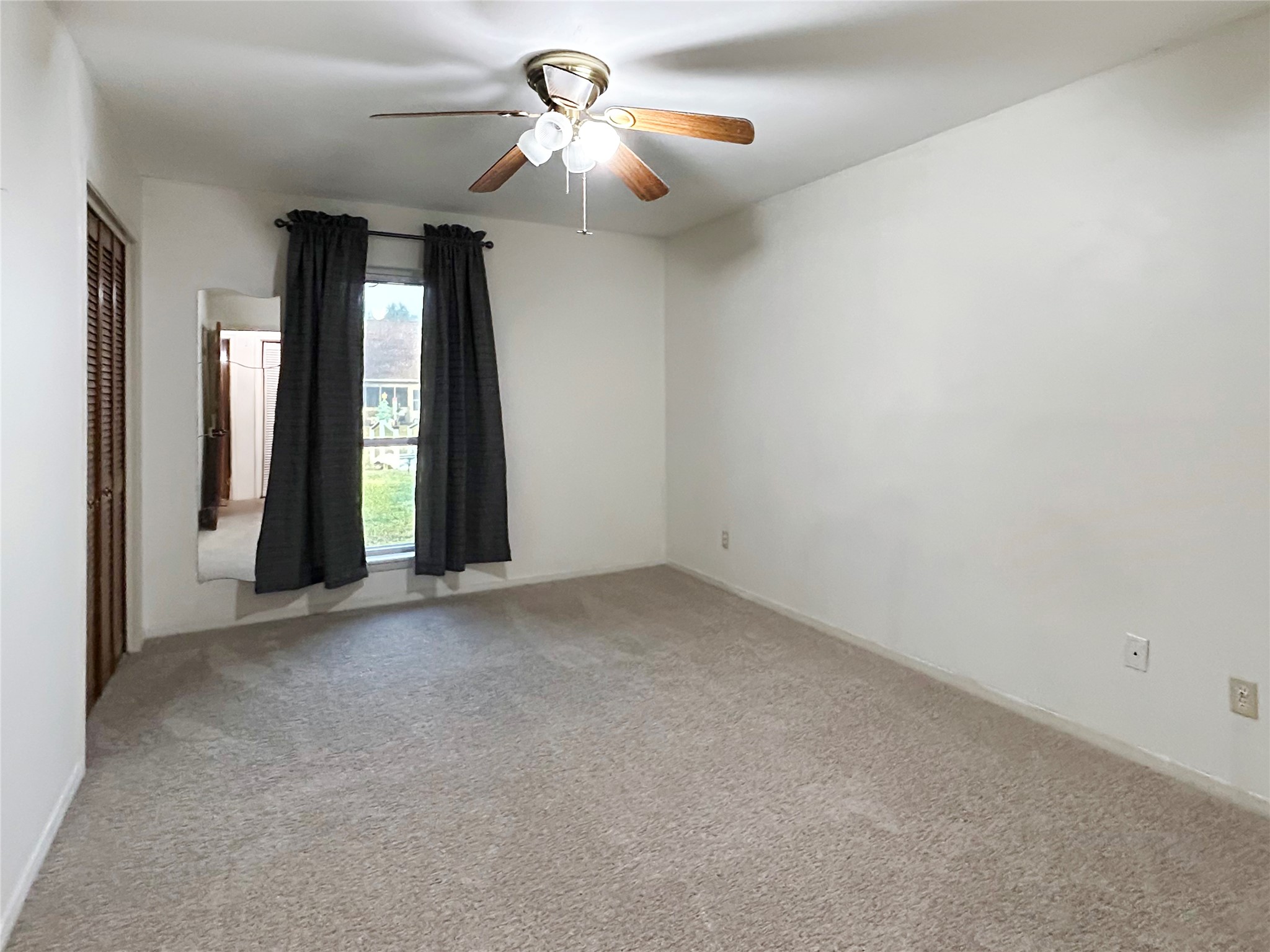 6132 Fox Ridge Drive Angleton, TX 77515 - Photo 19 of 28 wooden floor in an empty room with a window