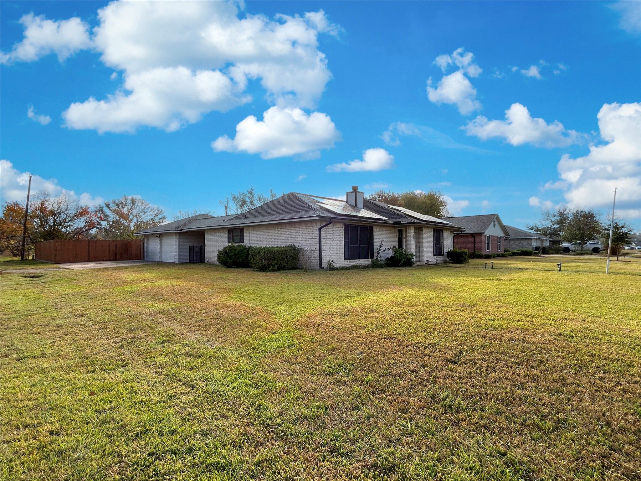 6132 Fox Ridge Drive Angleton, TX 77515 - Photo 6 of 28 a front view of a house with a big yard