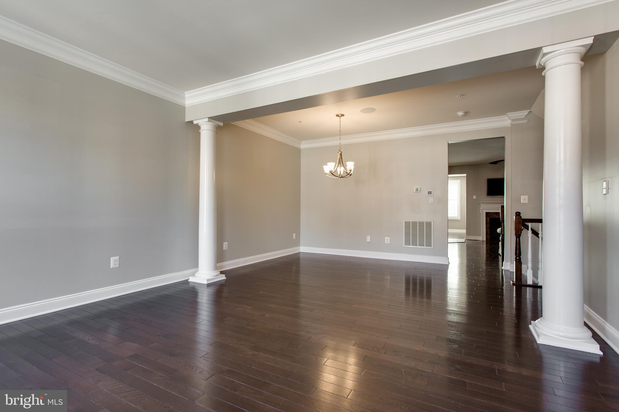 2265 Brimstone Place Hanover, MD 21076 - Photo 12 of 70 a view of a room with wooden floor