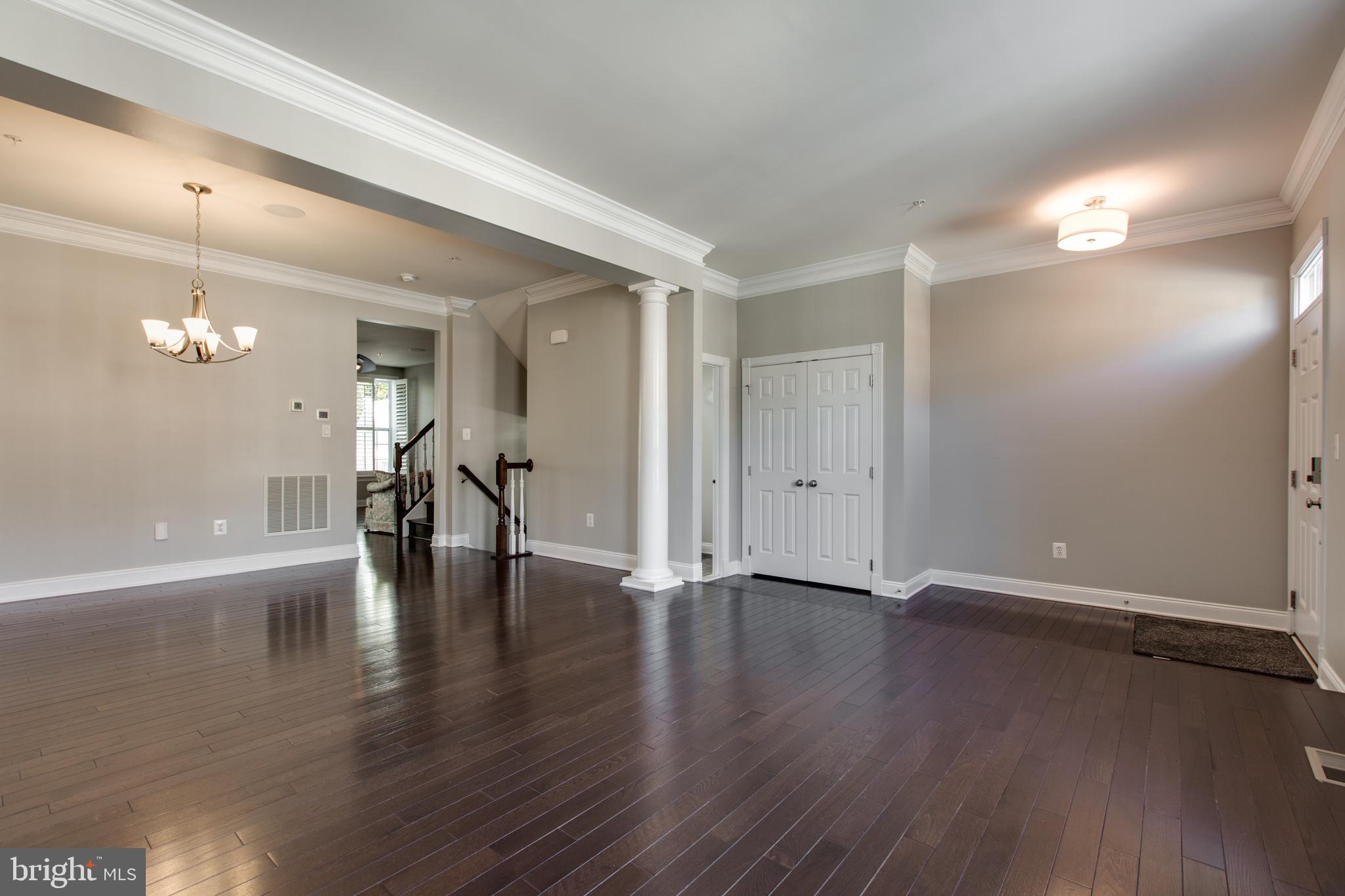 2265 Brimstone Place Hanover, MD 21076 - Photo 13 of 70 a view of an empty room with wooden floor