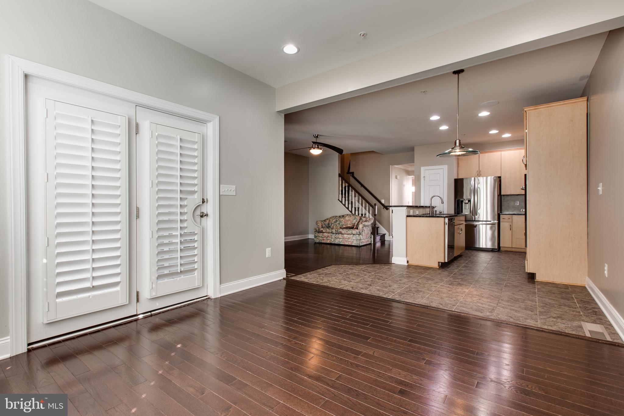 2265 Brimstone Place Hanover, MD 21076 - Photo 25 of 70 a view of a living room a wooden floor and a window