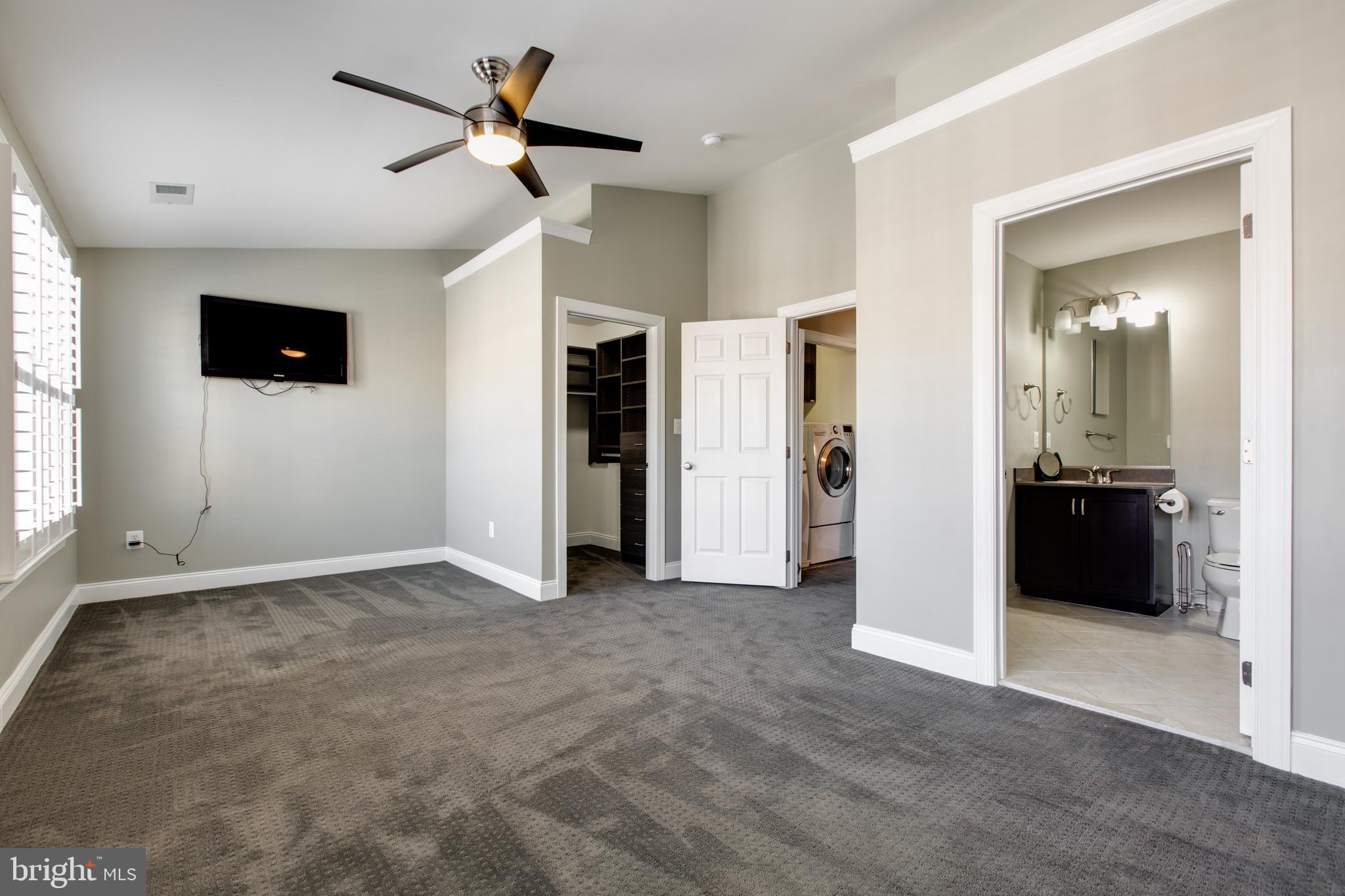 2265 Brimstone Place Hanover, MD 21076 - Photo 37 of 70 an empty room with closet and a flat screen tv