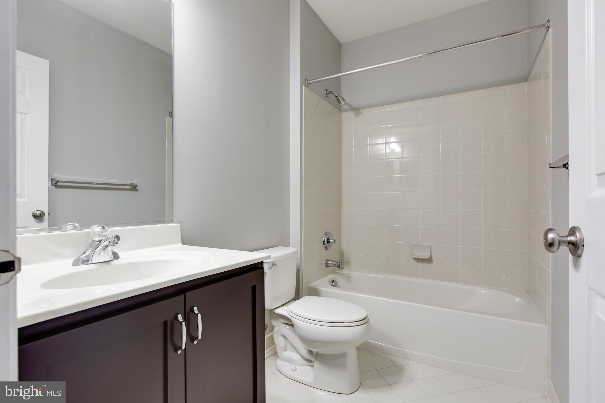 2265 Brimstone Place Hanover, MD 21076 - Photo 41 of 70 a bathroom with a sink a toilet and shower