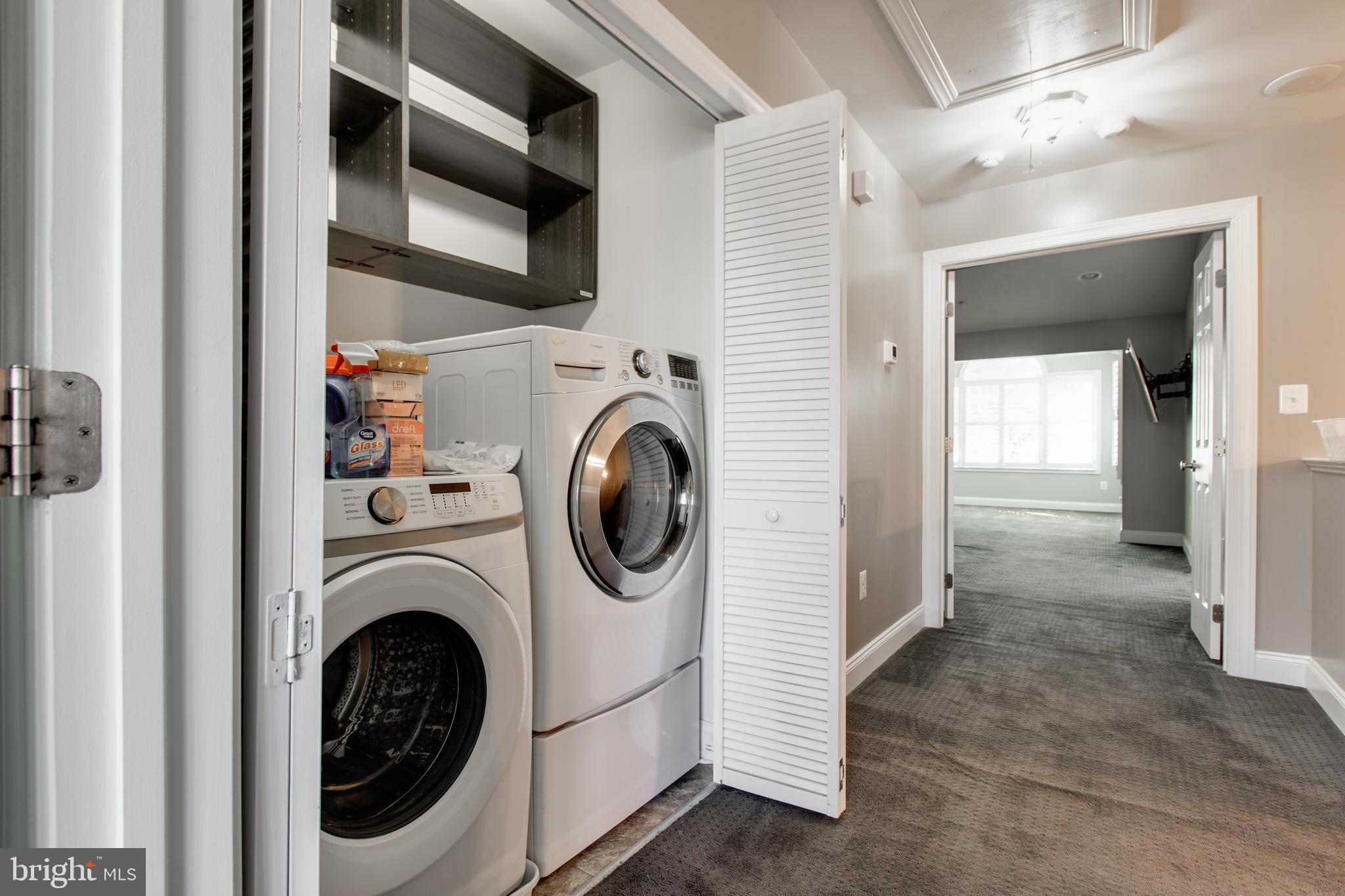 2265 Brimstone Place Hanover, MD 21076 - Photo 42 of 70 a view of a hallway with washer and dryer