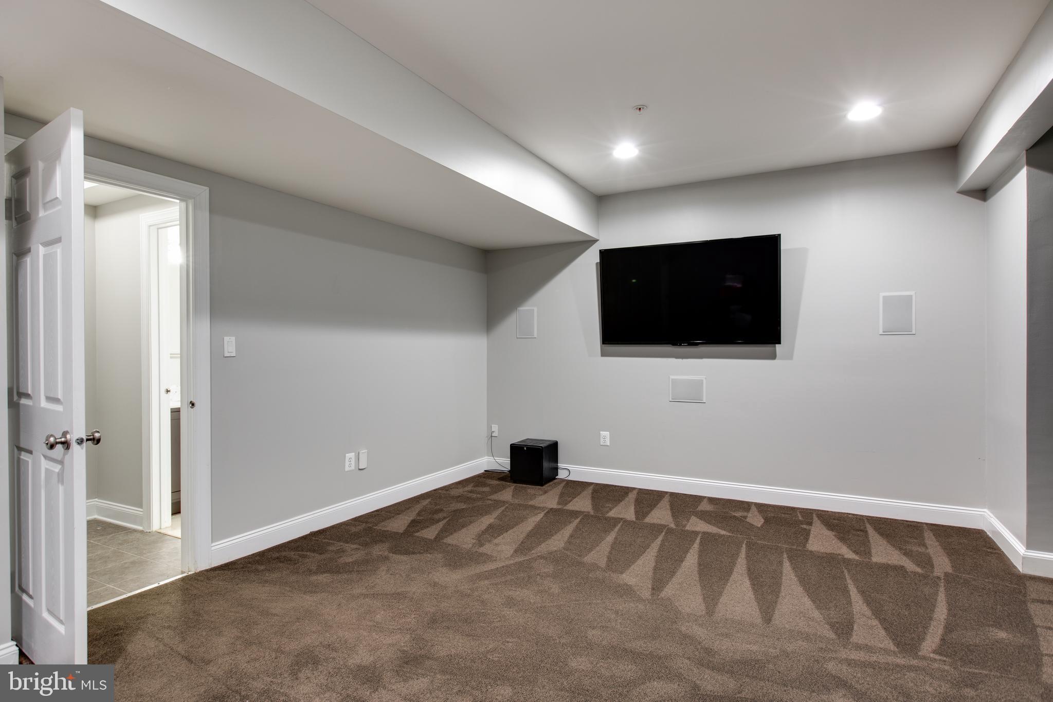2265 Brimstone Place Hanover, MD 21076 - Photo 45 of 70 a view of an empty room with wooden floor and windows