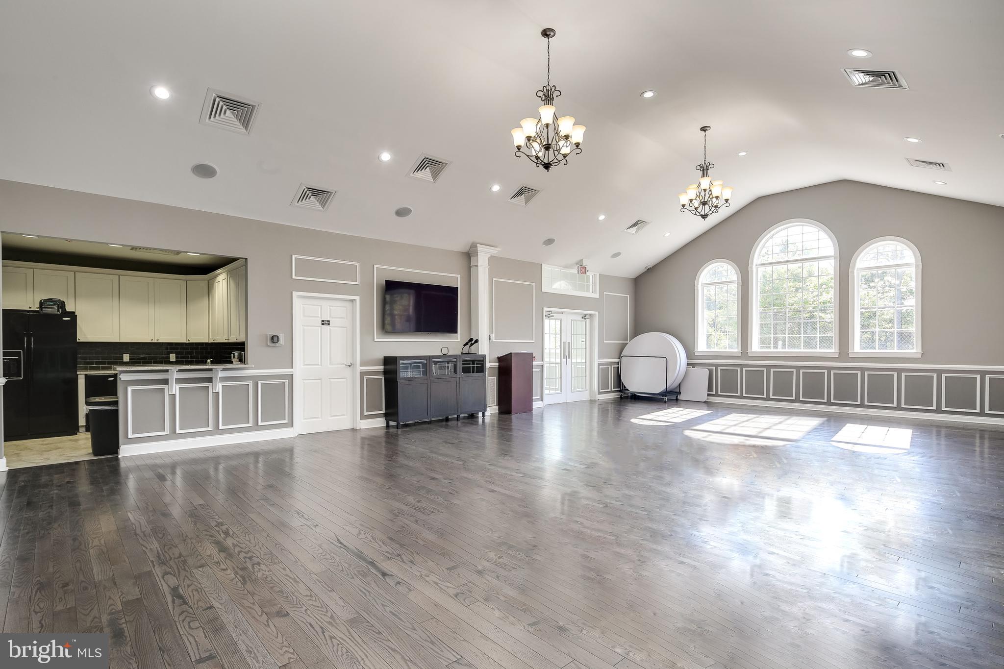 2265 Brimstone Place Hanover, MD 21076 - Photo 50 of 70 a view of a kitchen with a sink cabinets and wooden floor