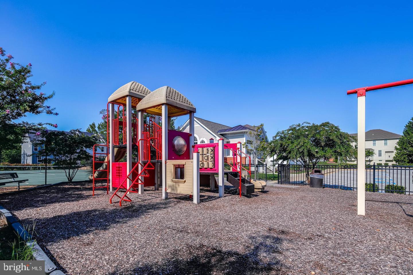 2265 Brimstone Place Hanover, MD 21076 - Photo 54 of 70 a view of a park with swings and slides