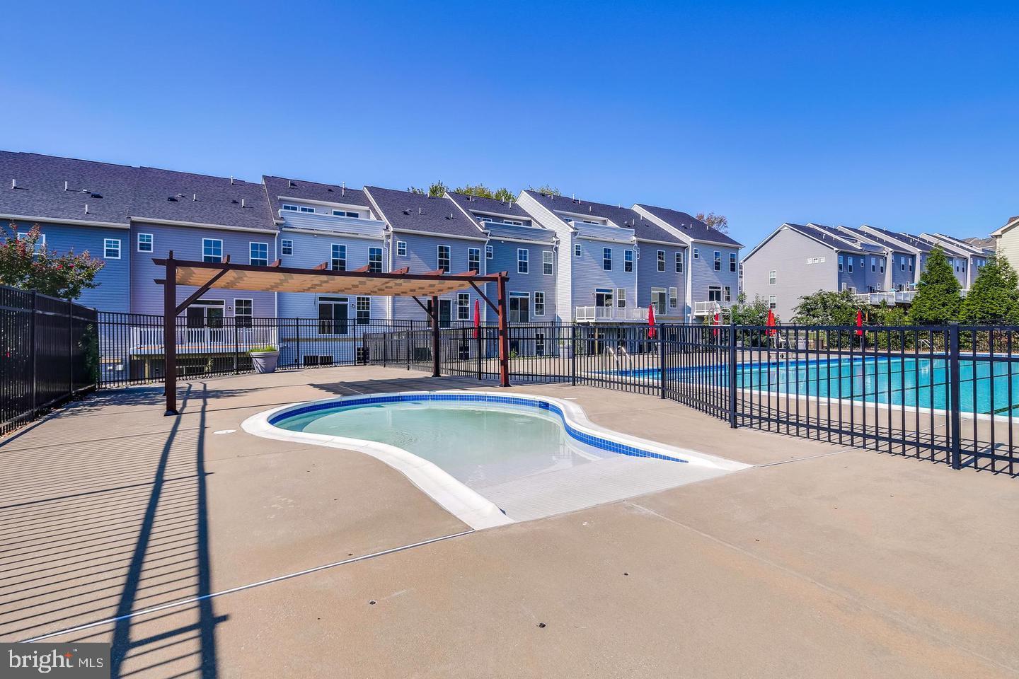 2265 Brimstone Place Hanover, MD 21076 - Photo 58 of 70 a view of a building with a swimming pool