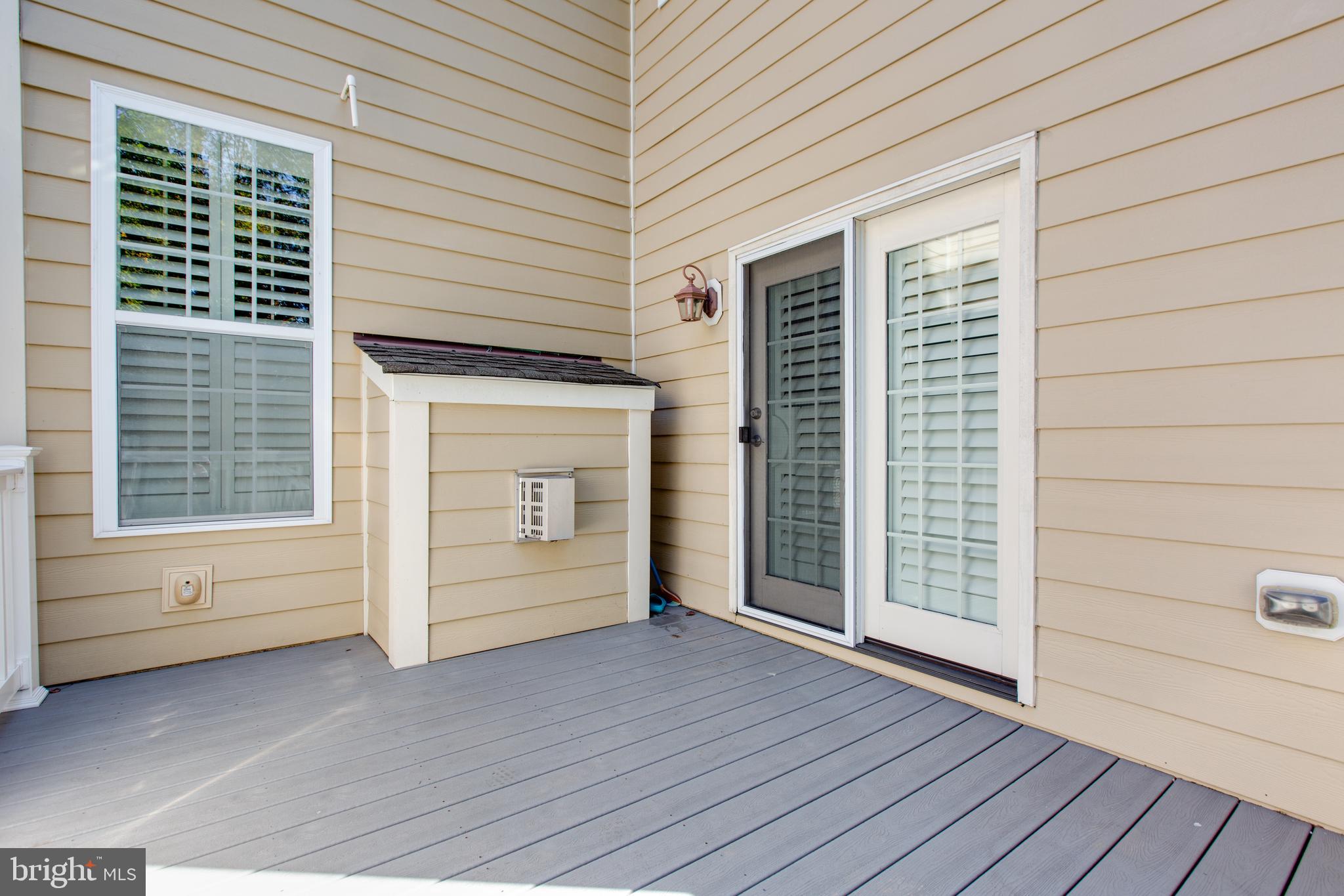 2265 Brimstone Place Hanover, MD 21076 - Photo 6 of 70 an empty room with wooden floor and windows