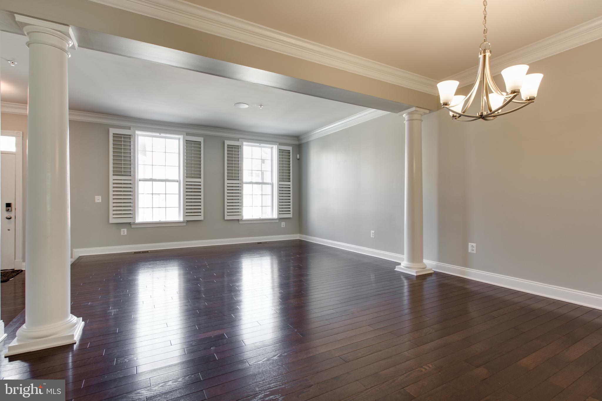 2265 Brimstone Place Hanover, MD 21076 - Photo 10 of 70 a view of empty room with wooden floor and fan