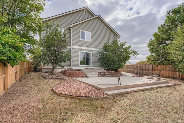 a view of a backyard with a patio