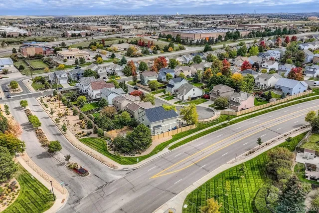 an aerial view of residential houses with outdoor space