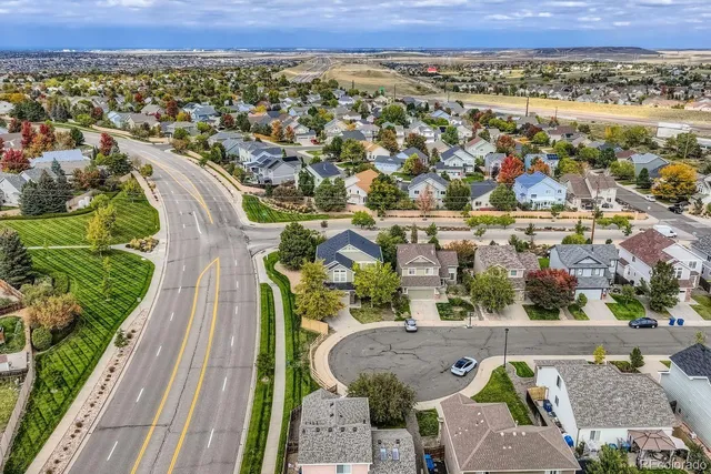 an aerial view of a house with a garden