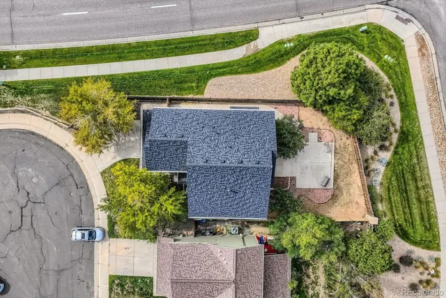 an aerial view of a house with a garden