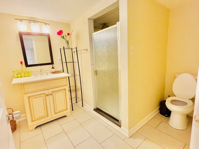 a bathroom with a sink toilet and mirror