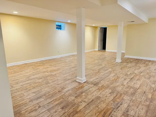 a view of a livingroom with wooden floor