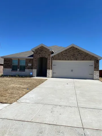 a front view of house with a yard